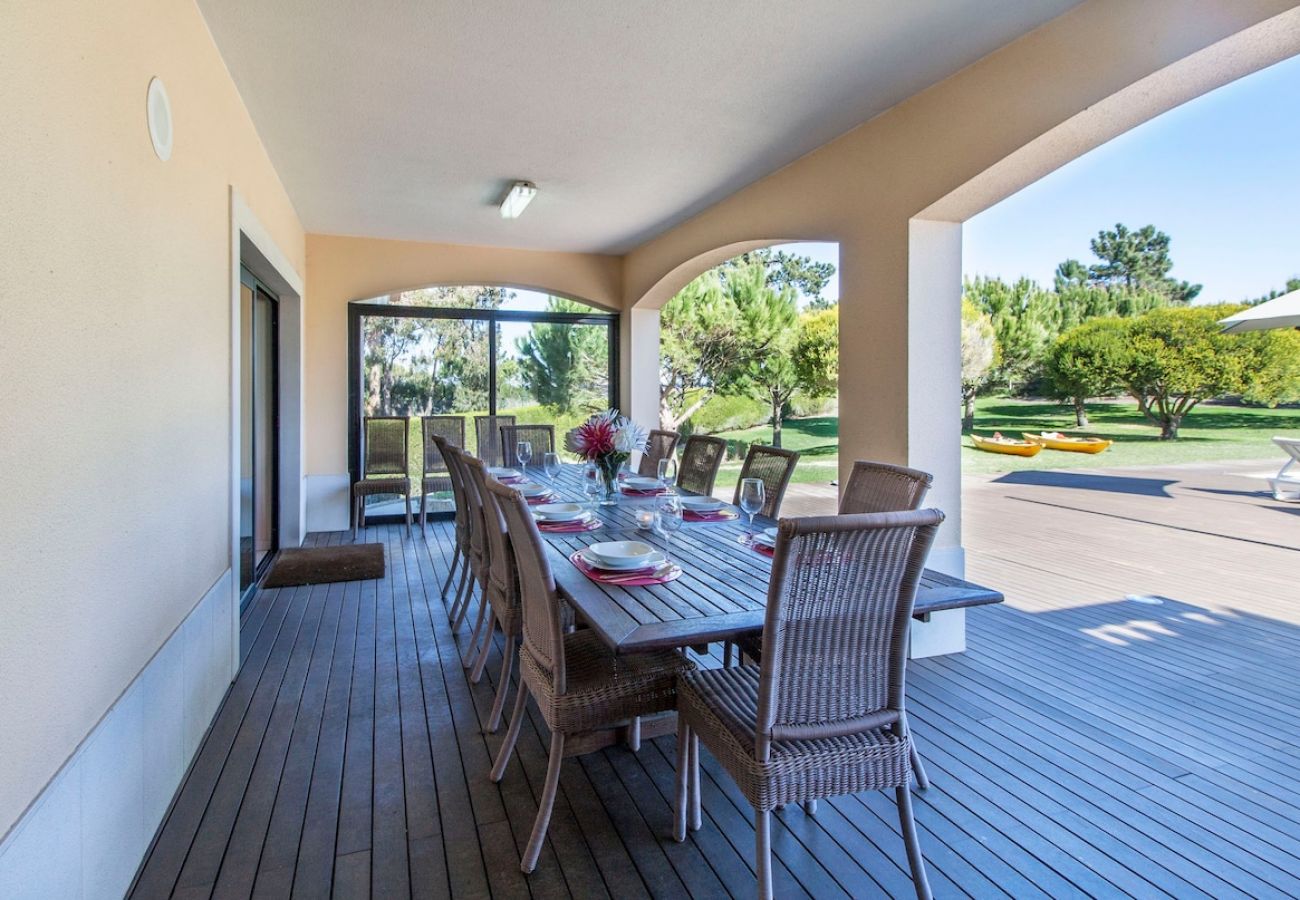 Dining area in the outdoor space overlooking the pool. 