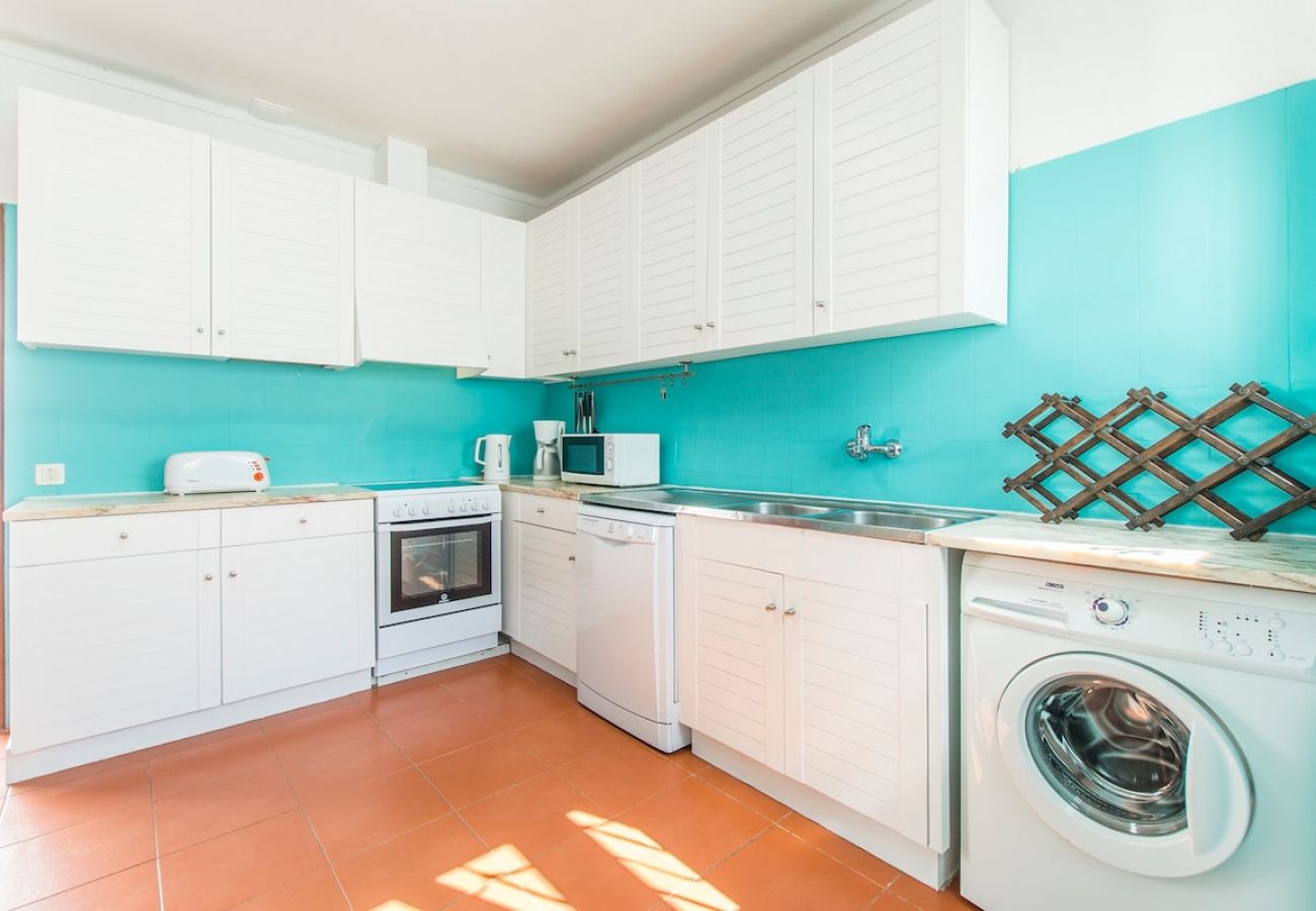 Fully equipped kitchen with natural light. 