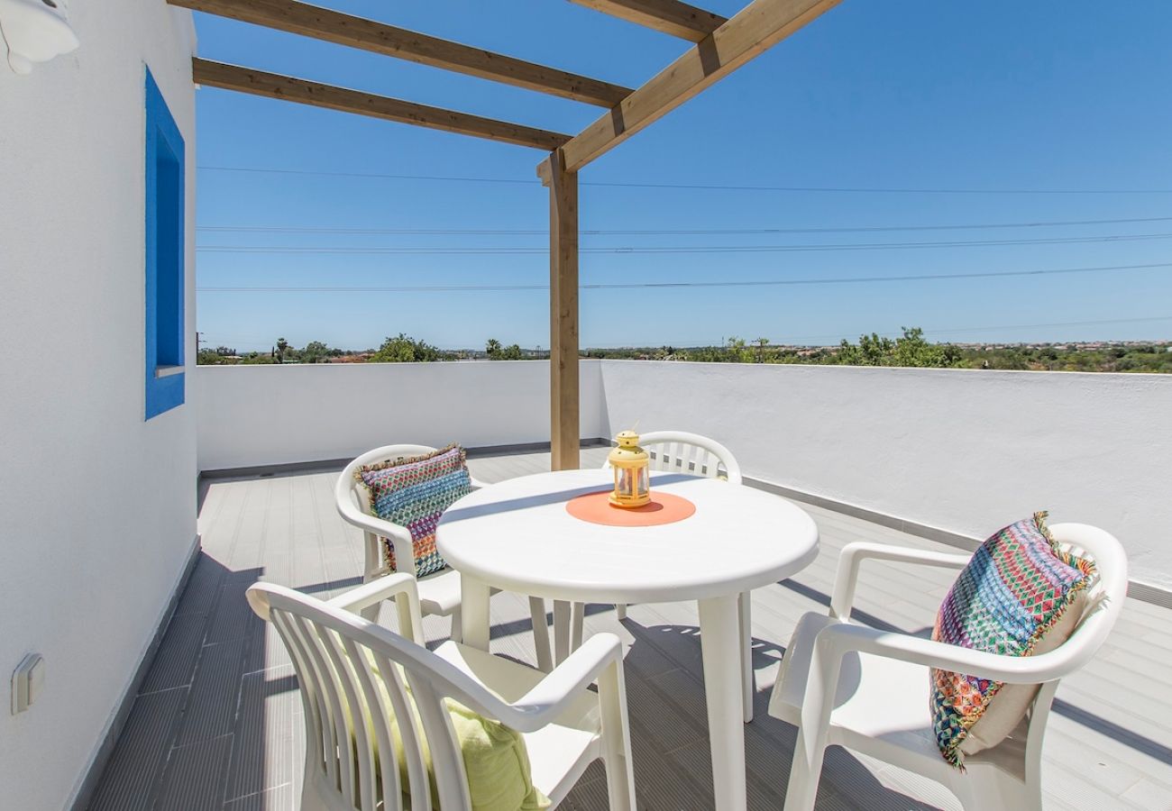 Spacious balcony with dining area.