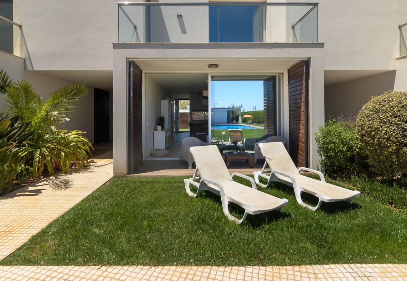 Outdoor leisure space overlooking the pool.