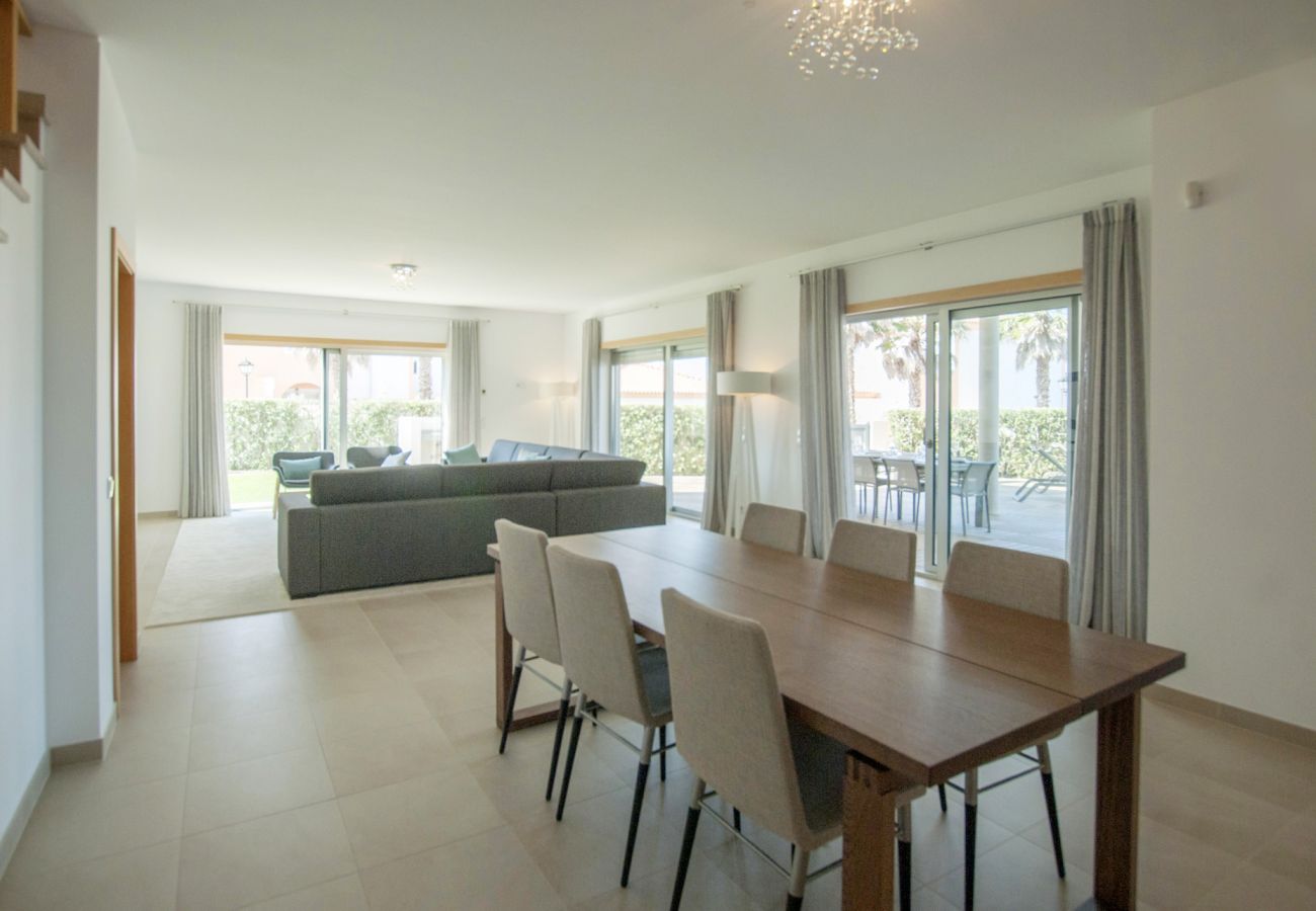 Open space living room with dining room with natural light.