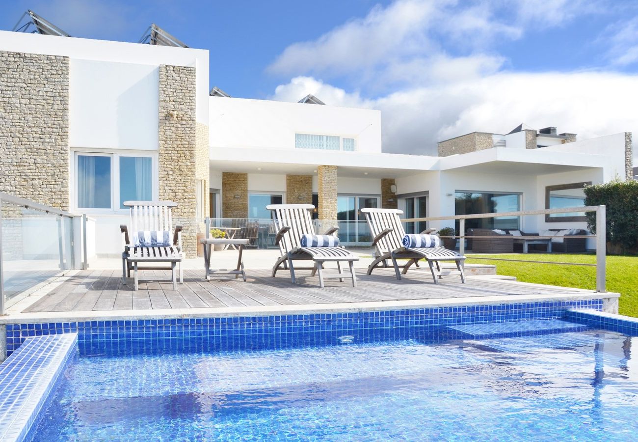 Outdoor dining area with sea views.