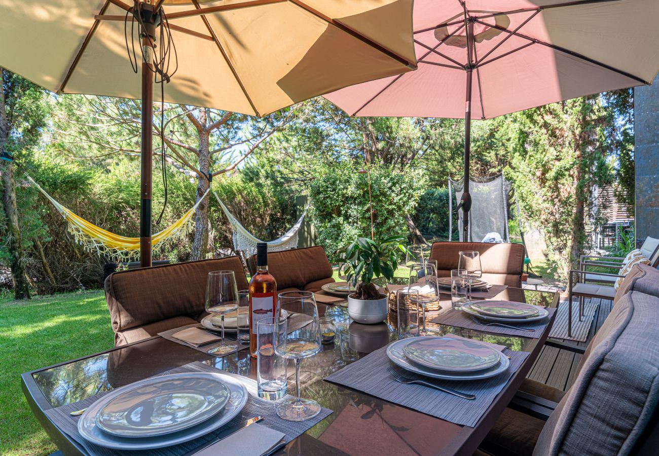 Outdoor area with leisure space and dining table.